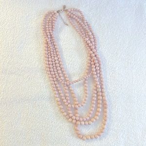 Pink layered beaded necklace.
